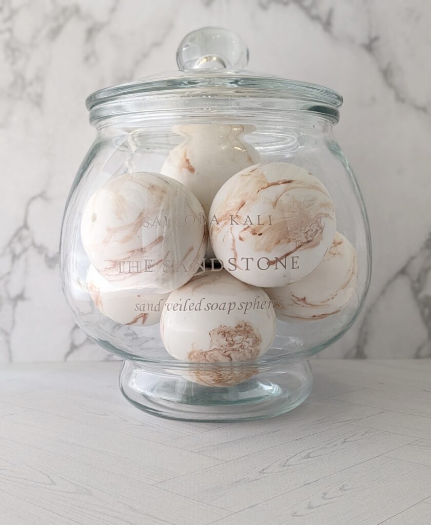 Warm golden mandarin and desert fig scented Sandstone soap spheres.