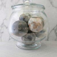 Rich, atmospheric scent of Nero Sand Strata featuring smoked tea and dark woods.