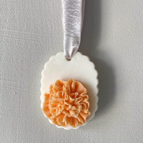 Salsola Kali Apricot Carnation soap on a ribbon, a vibrant flower sculpture.