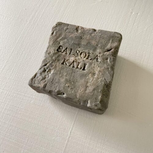 Hand-fractured black Basalt volcanic bath bar for premium skincare.