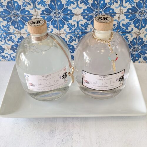 A premium, decorative bottle of 'oh la la' Cashmere & Jasmine bubbly bath, perfect for a high-end self-care gift.
