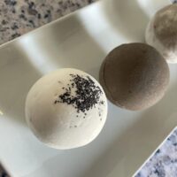 Luxury frothy bath truffle holiday curation, a rare and artisanal self-care presentation.