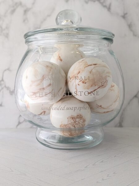 Warm golden mandarin and desert fig scented Sandstone soap spheres.