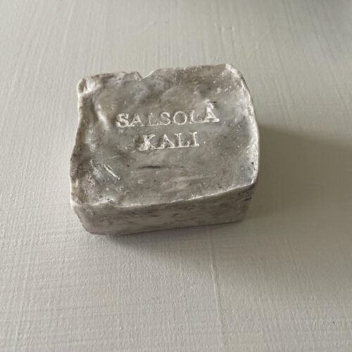Granite quarried soap bar featuring irregular stone-cut mineral flecks.