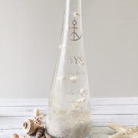 A coastal-inspired self-care ritual featuring the Salsola Kali Abyss 41 oz luxury bubble bath.