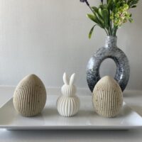 Whimsical sculpted bunny and egg soaps for a playful yet premium spring display.