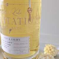 Side profile of the 62 oz Salsola Kali Invitation bubbly bath bottle showing the premium packaging.