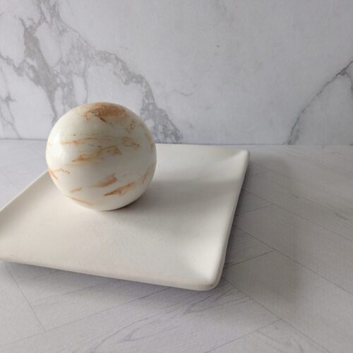 The Sandstone soap spheres evoking a sun-heated stone mineral fragrance.