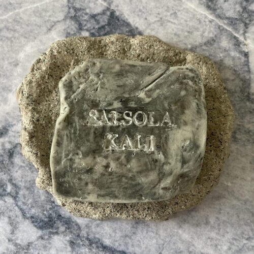 Sculptural grey stone-cut Ash soap for a minimalist bathroom aesthetic.