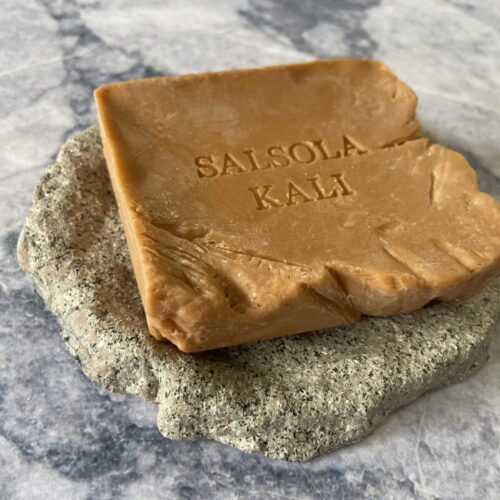 Salsola Kali Terracotta soap bar with hand-fractured stone-cut edges.