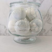 Salsola Kali The White Monolith veined soap spheres in a glass jar.