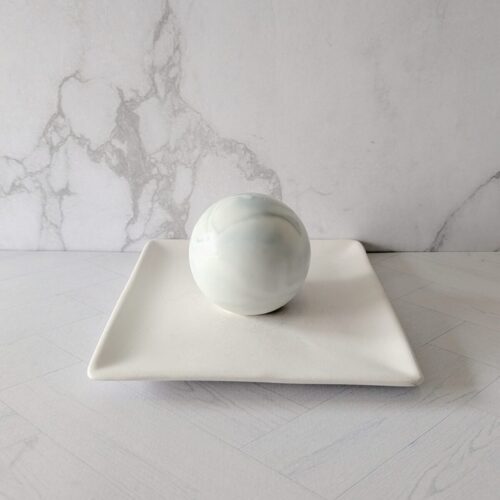 Architectural White Monolith soap spheres with a soft cashmere woods scent.