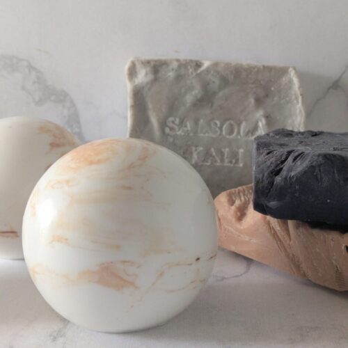 Warm golden mandarin and desert fig scented Sandstone soap spheres.