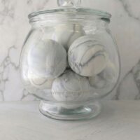 Clean bergamot and mineral air scented White Monolith soap spheres.